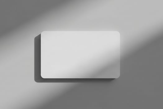 Minimalist Blank Card Mockup Soft Light and Shadow Play on Grey Background photo