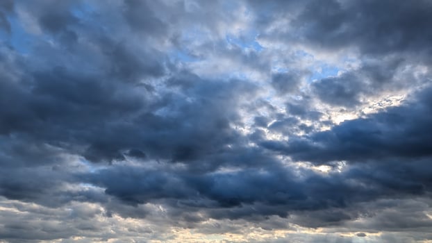 Stunning and Dramatic Cloudscape Featuring Both Dark and Light Clouds in Striking Contrast photo