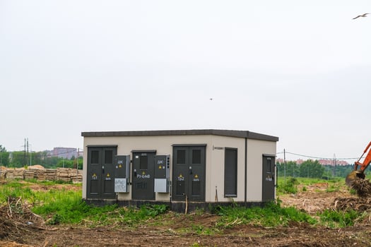 Moscow, Russia, 18.06.2025 A electrical substation building in a field. Power distribution concept for urban infrastructure development. photo