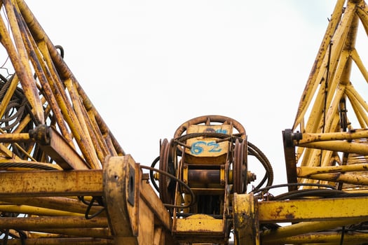 Moscow, Russia, 18.06.2025 Close-up view of old yellow rusty crane against clear sky. Industrial construction equipment for heavy lifting jobs. photo