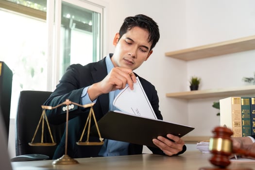 Legal Document Review. Lawyer preparing case files for client consultation. photo