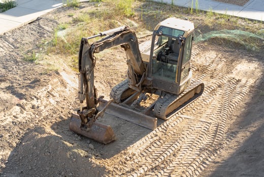 Excavator Digging on Construction Site photo