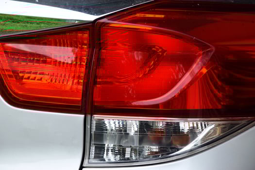 Automotive Taillight Closeup on a Metallic Silver Car photo