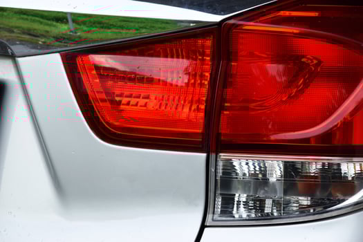 Modern Taillight Design on Silver Car Closeup photo