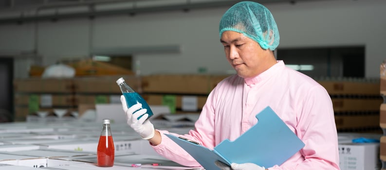 Factory of food or beverages, quality control check juice and water bottle, food or beverages on warehouse before send product to the customer. Quality control or assurance, Good standard photo