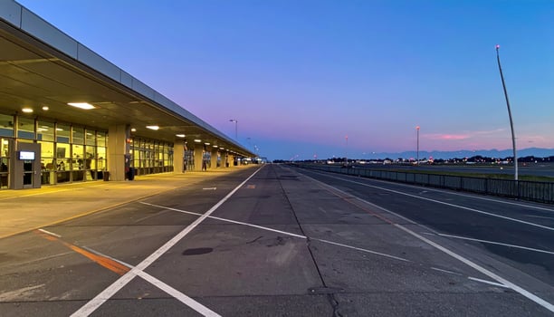 A long empty airport terminal at dusk photo