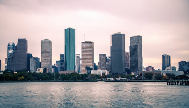 A city skyline with tall buildings in the background photo
