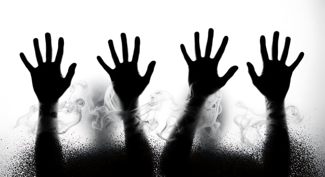 Silhouettes of hands pressed against frosted glass photo