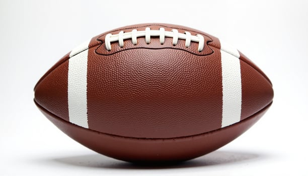 Brown football with white stripes and laces. photo