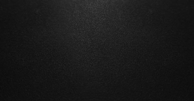 Dark textured close-up. Macro shot of detailed black leather background. photo