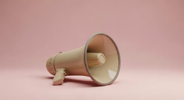 Retro megaphone on a soft pink background photo