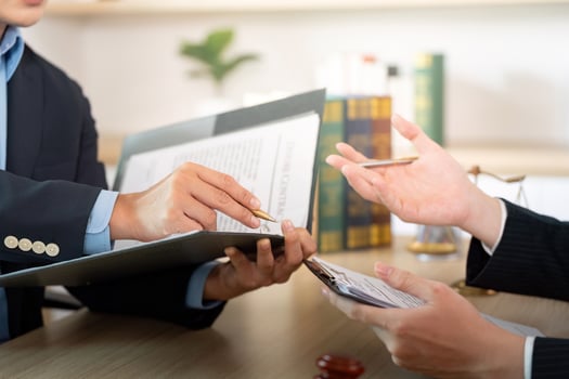 Document Review. Lawyer discussing legal papers with a client. photo