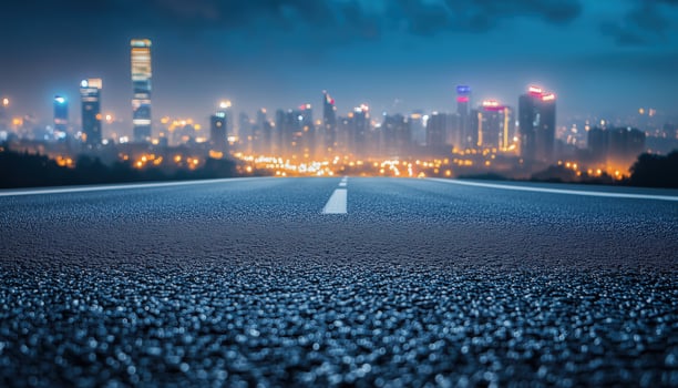 Night Cityscape With Empty Asphalt Road And Sky Featuring Bokeh Effect Of Lights. A Serene And Calm Urban Landscape photo