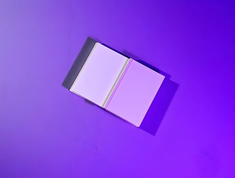 A white book on a purple background photo