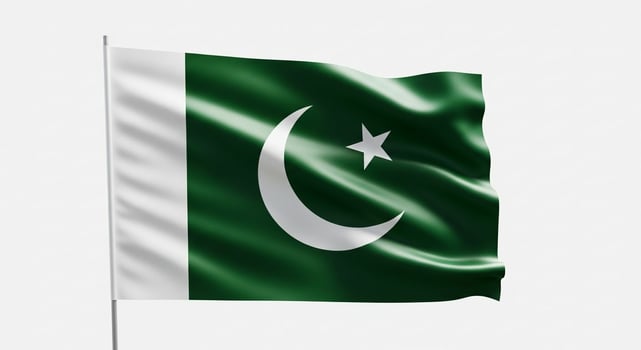 Waving Flag of Pakistan with Green Field White Stripe Crescent and Star. photo