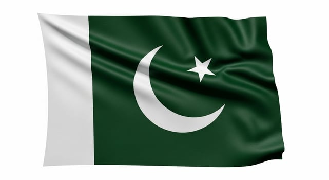 Waving Pakistan Flag Green and White Symbolism. photo