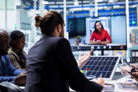 Solar panel factory management doing videocall with investors to showcase manufacturing strategies. Photovoltaics plant executives doing videoconference to present shareholders production growth data photo