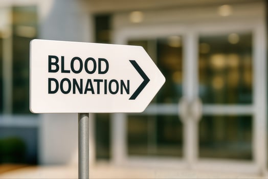 Blood Donation Signpost with Arrow Directing to Donation Center photo
