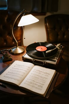 a vintage record player and a book on a table photo