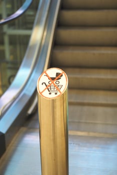 No shopping carts allowed in the escalator area photo