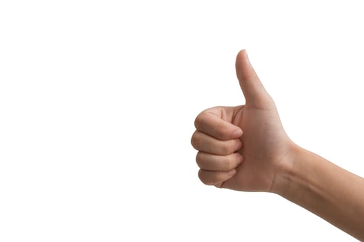 Human hand showing thumbs up gesture isolated on white background representing approval, success, like, and agreement photo