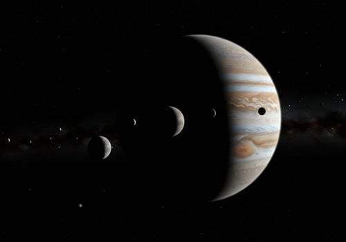 Jupiter and its moons in the night sky photo