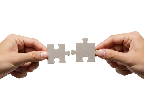 Two hands holding a piece of puzzle photo