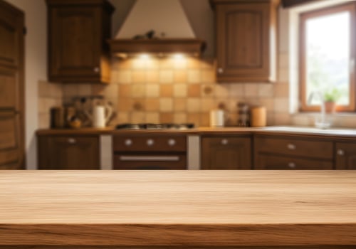 Wooden kitchen countertop with a stove in the background photo