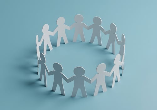 A group of people holding hands in a circle photo