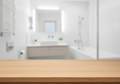 Wooden table top in a bathroom with a white tub photo