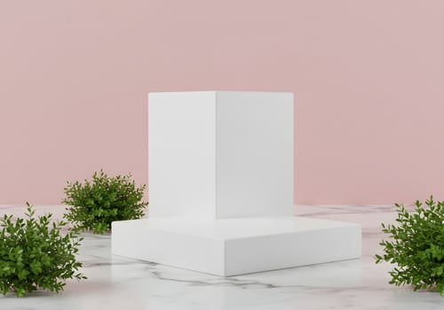 A white square box on a pink background photo