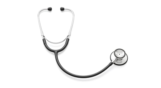 Medical Stethoscope with Black Tubing and Silver Chest Piece on White Background photo