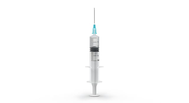 Medical Syringe with Needle in White Background for Healthcare and Vaccination Campaigns photo