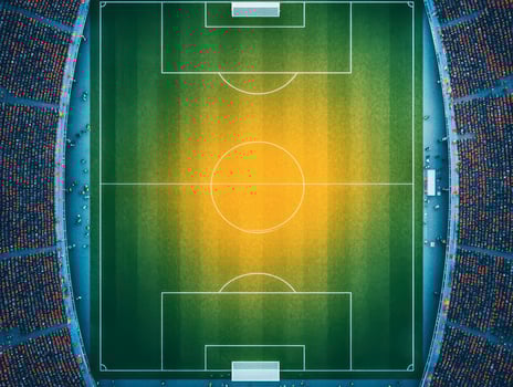 Aerial view of a vibrant soccer field with goals and bright green grass. photo