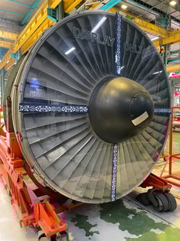 Large commercial aircraft turbofan with open engine cowling for check photo
