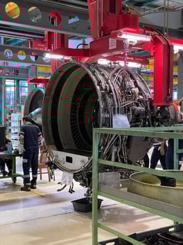 Aerospace Industry Professionals Servicing a Large Commercial Plane Engine. photo