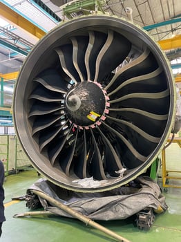 Front view of airplane turbine fan inside engineering service hangar photo