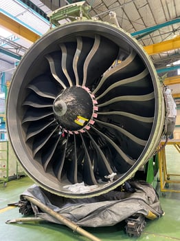 Industrial scale aviation engineering work on airplane turbine system photo