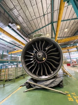 Heavy duty aircraft engine parts exposed in hangar during inspection photo