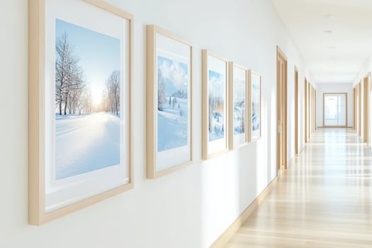 Gallery hallway with framed winter landscape photographs, bright and spacious ambiance. photo