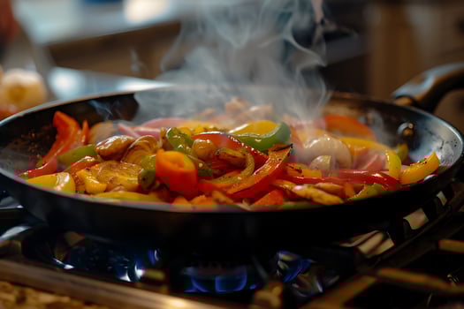 Sizzling Colorful Vegetables Cooking in a Hot Pan on a Stove. photo