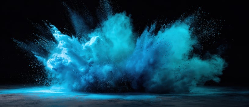 The explosion of vibrant blue powder creating a stunning abstract scene. photo