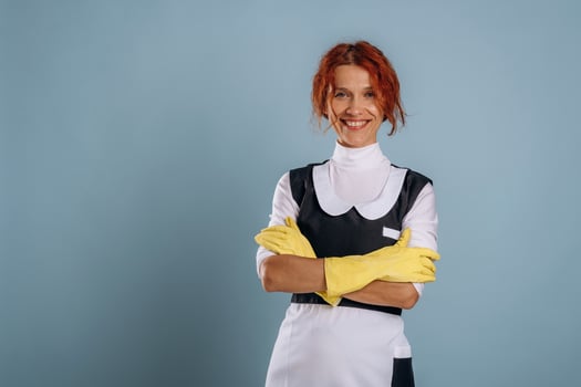 Smiling maid with yellow gloves photo