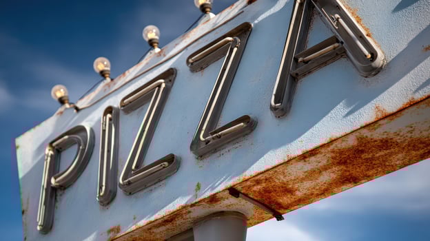 Pizza Sign With Light Bulbs Against Clear Sky photo