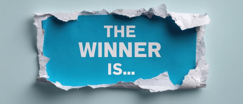 The Winner Is Revealed Through Torn Paper on a Bright Blue Background photo