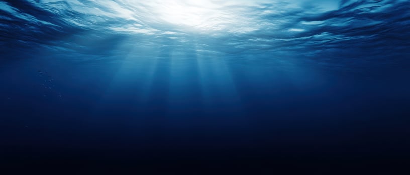 The serene underwater scene illuminated by gentle rays of sunlight. photo