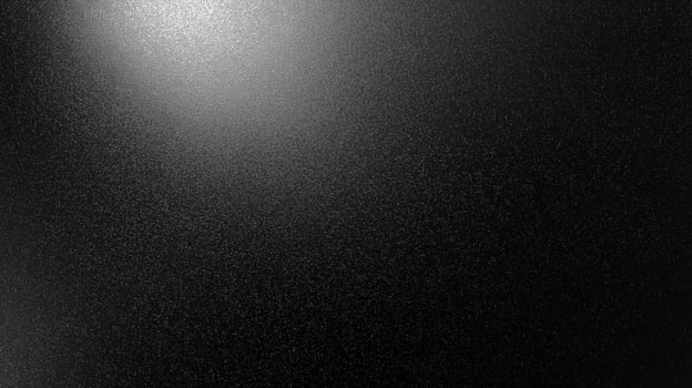 Texture of a dark, glossy surface highlighting subtle light reflections and minimal grain patterns photo