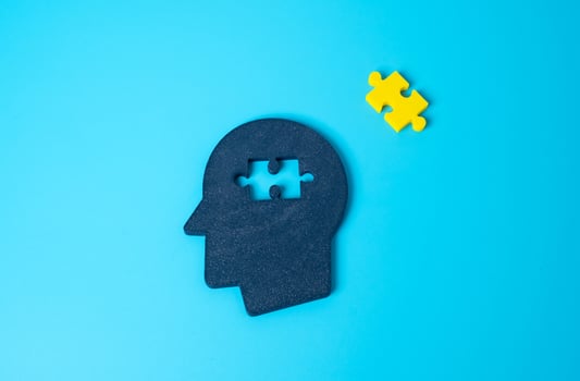Head and missing puzzle, concept. What is missing for happiness and peace of mind. Incomplete self-realization. Search for inner balance. Gaps in mental well-being. Emotional void. photo
