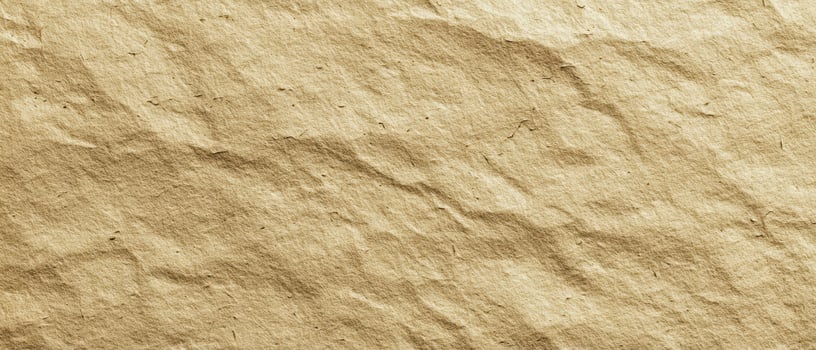 The intricate texture of crumpled golden paper for creative projects. photo