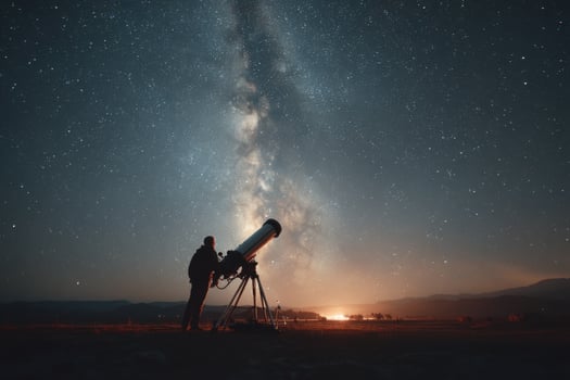 Man looking at the milky way with telescope photo